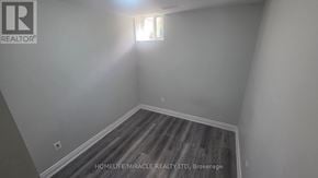 Brampton (Northwest Brampton) apartment for rent - A room with a window and wooden flooring.