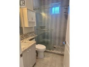 Vancouver apartment for rent - A bathroom with a toilet, sink, and shower.