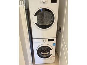 Vancouver apartment for rent - A Realty washing machine is stacked on top of another Realty washing machine.