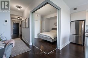 Ottawa condo for rent - A bedroom with a bed, dresser, and mirror.