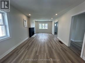 Mississauga (Lakeview) apartment for rent - A room with wood flooring and a large window.