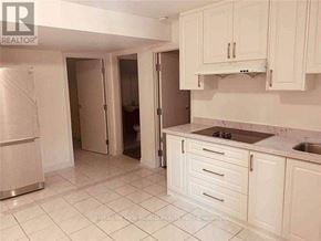 Toronto (Agincourt South-Malvern West) apartment for rent - A kitchen with white cabinets and a marble countertop.