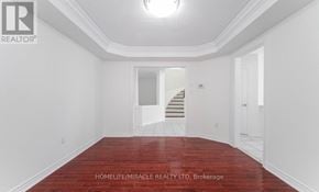 Brampton (Snelgrove) apartment for rent - A room with a red floor and white walls.