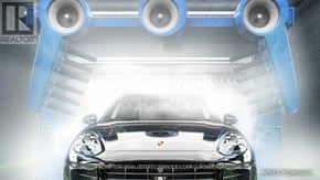 Toronto (Waterfront Communities) condo for rent - A black Porsche is being washed in a car wash.