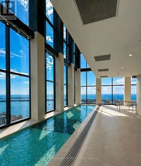 Toronto (Waterfront Communities) condo for rent - A large indoor swimming pool with a view of the ocean.