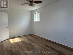 Casselman apartment for rent - A room with a ceiling fan and a window.