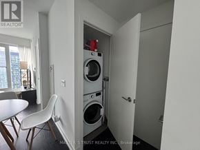 Toronto (Waterfront Communities) condo for rent - A laundry room with a washer and dryer in it.