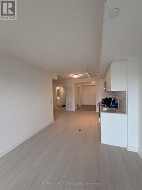 Toronto (Humber Heights) condo for rent - A modern kitchen with white cabinets and stainless steel appliances.