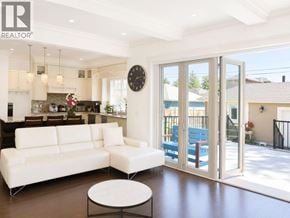 Vancouver apartment for rent - A living room with a white couch and a coffee table.