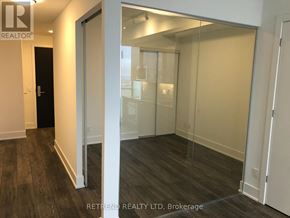 Toronto (Church-Yonge Corridor) condo for rent - A hallway with a glass door leading to another room.