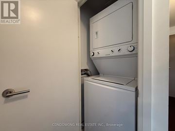 Toronto (Thorncliffe Park) condo for rent - A white oven with a door open is in a kitchen.