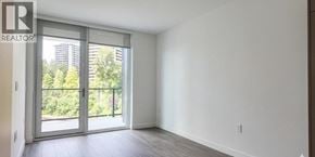 Burnaby apartment for rent - A realtor logo is on a glass door.