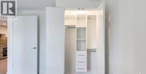 Burnaby apartment for rent - A white door is open to a hallway.
