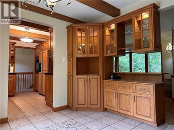 Ancaster apartment for rent - A kitchen with wooden cabinets and a tile floor.