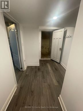 Norfolk multi-family for rent - A hallway with wood flooring and white walls.