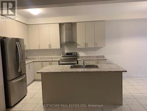 Centre Wellington (Fergus) apartment for rent - A kitchen with a marble countertop and stainless steel appliances.