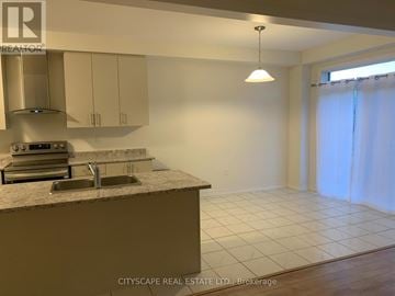 Centre Wellington (Fergus) apartment for rent - A kitchen with a sink and a stove top oven.