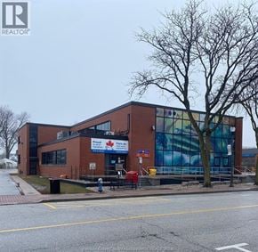 Amherstburg apartment for rent - A building with a sign that says "Proud to be Canadian" on it.