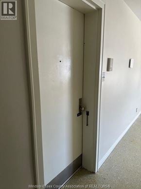 Amherstburg apartment for rent - A white door with a black handle and lock.