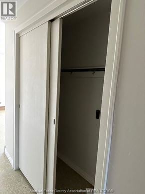Amherstburg apartment for rent - A white door is open to a dark room.