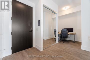 Toronto (Waterfront Communities) condo for rent - A room with a desk and a computer with a black chair.