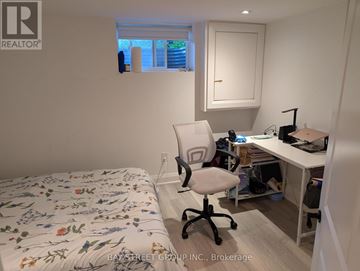 Toronto (Lansing-Westgate) apartment for rent - A bedroom with a bed, desk, and chair.