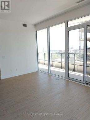 Toronto (Church-Yonge Corridor) condo for rent - A room with a sliding glass door leading to a balcony.