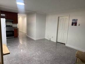 Surrey apartment for rent - A kitchen with white walls and a white door.