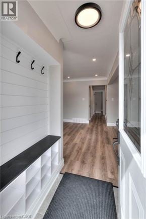 Kitchener apartment for rent - A hallway with a bench and a light on the ceiling.