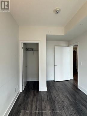Toronto (Don Valley Village) condo for rent - A room with a white door and a black floor.