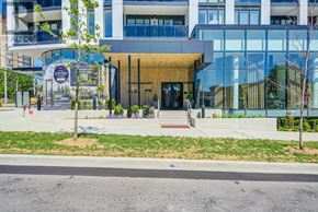 Mississauga (Mississauga Valleys) condo for rent - A modern building with a glass facade and a wooden entrance.