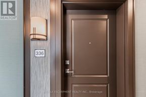 Hamilton (Waterdown) condo for rent - A brown door with a number 336 on the wall above it.