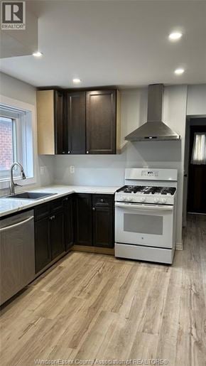 Windsor apartment for rent - A kitchen with a white stove top oven and black cabinets.