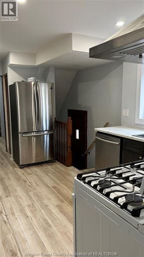 Windsor apartment for rent - A kitchen with a stainless steel refrigerator and a stove top oven.