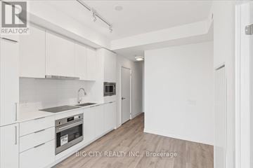 Toronto (Newtonbrook East) condo for rent - A white kitchen with a sink and stove top oven.