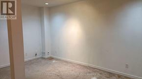 Markham (Unionville) townhouse for rent - A room with a carpet floor and walls painted in a light color.