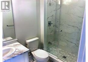 Caledon (Caledon East) apartment for rent - A bathroom with a toilet, sink, and shower.