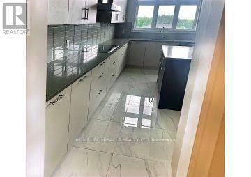 Caledon (Caledon East) apartment for rent - A kitchen with a tiled floor and a window.