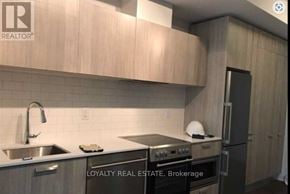Toronto (Church-Yonge Corridor) condo for rent - A kitchen with a sink, stove, and refrigerator.