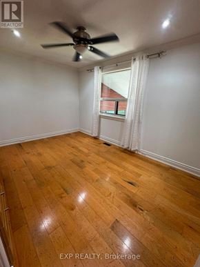 Oakville (Wo West) apartment for rent - A room with wooden flooring and a ceiling fan.