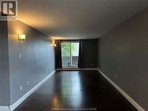 Chatham condo for rent - A room with a sliding glass door leading to a balcony.