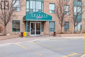 Mississauga (Cooksville) condo for rent - The front of the Emerald Gardens building with a sign that says "135" on it.