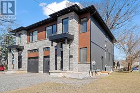 Welland (N. Welland) apartment for rent - A modern house with a grey and brown exterior is for sale.