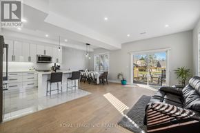 Welland (N. Welland) apartment for rent - A modern kitchen with a dining area and a living room with a couch.