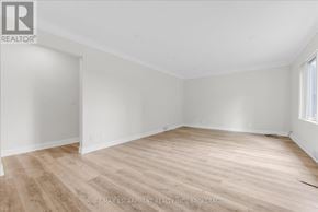 St. Catharines (Fairview) apartment for rent - A room with wooden flooring and white walls, likely for sale.