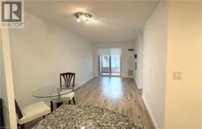Toronto condo for rent - A realtor's photo of a room with a glass table and chairs.