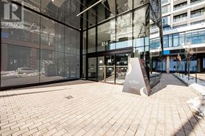 Toronto (Dovercourt-Wallace Emerson-Junction) condo for rent - A glass building with a sign that says "REALTOR" on it.