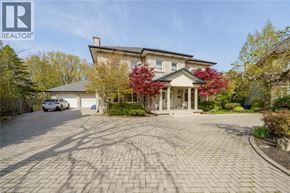 Stoney Creek apartment for rent - A large house with a driveway in front of it.