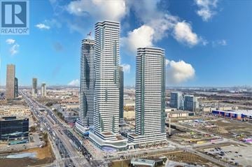 Vaughan (Vaughan Corporate Centre) condo for rent - Two tall buildings are under construction in a city.