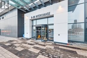 Vaughan (Vaughan Corporate Centre) condo for rent - The entrance to a building with the sign "3-28 Interchange" on it.